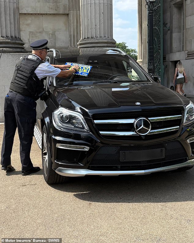 Special Chief Officer James Deller from the Met Police, who was in attendance at the operation, said that the operation represented the force's commitment to tackling anti-social behaviour. Pictured: a Met Police officer seizes a vehicle