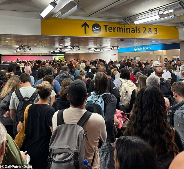 A sea of passengers wait outside Heathrow Airport terminals two and three which were closed due to the 'technical fault' on Tuesday last week