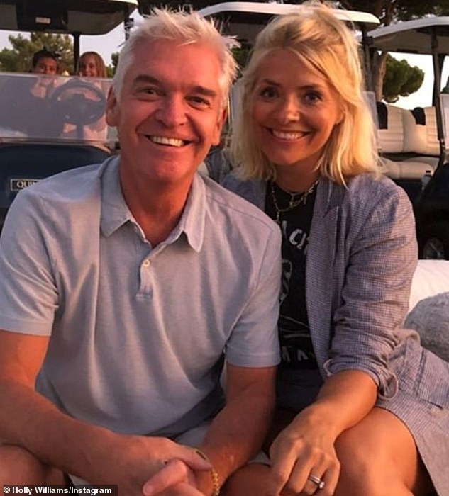Holly and Phillip are pictured together in Portugal, prior to their bitter fall-out