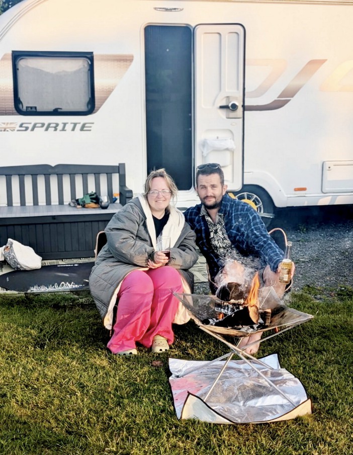 Rachel Hale, 39 and husband Lewis 35, live in a caravan in Anglesey, Wales. A couple spend just £330 a month living full-time on a campsite  and only work two days a week. Rachel Hale, 39 and husband Lewis 35, sold their home and used their £30k savings to travel the UK in a campervan for a year. Now, after their funds began to run low the couple live full-time at a campsite in Anglesey, Wales, after purchasing a caravan and working on the site for the past year. Lewis is a part-time camp warden and Rachel works in a local cafe, but they both only work twice a week. Rent and bills is free and included for workers on the site, with the pair paying just £8 per month for gas to cook their meals with. Once the camping season ends in October, the couple hope to travel across Europe in their campervan as they will have saved £8,000 from their low budget life. Photo released 12/08/2025