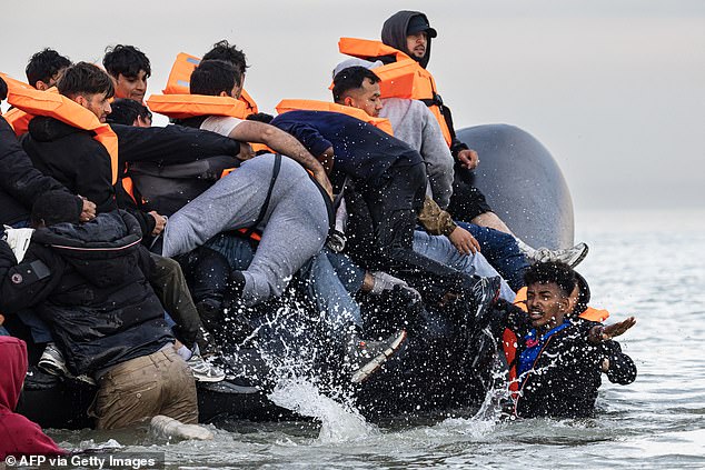 Migrants were seen desperately trying to board one of the dinghies, with some falling back into the sea