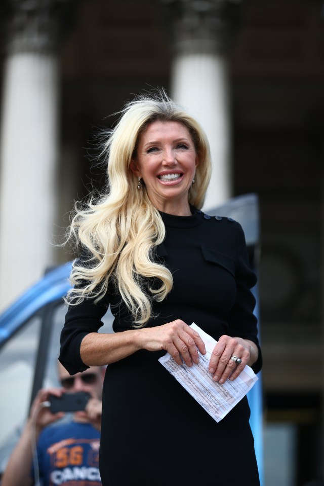 Kate Shemirani speaking at an anti-vaccine rally.
