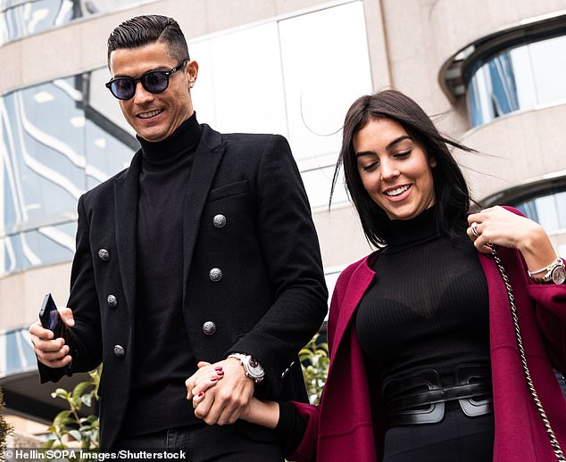 Ronaldo and Rodriguez hold hands outside a Madrid courthouse in 2019