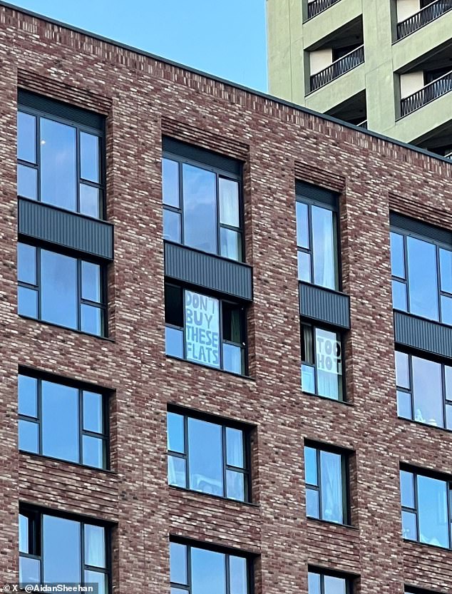 Last year residents in Leaside Lock, in east London, put up desperate signs in their windows as they struggled with extreme temperatures (pictured)