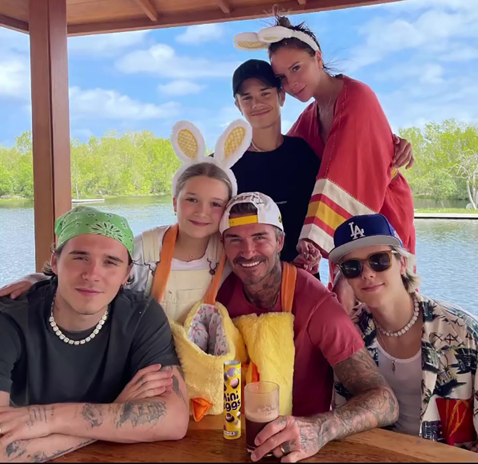 The Beckham family together outdoors.