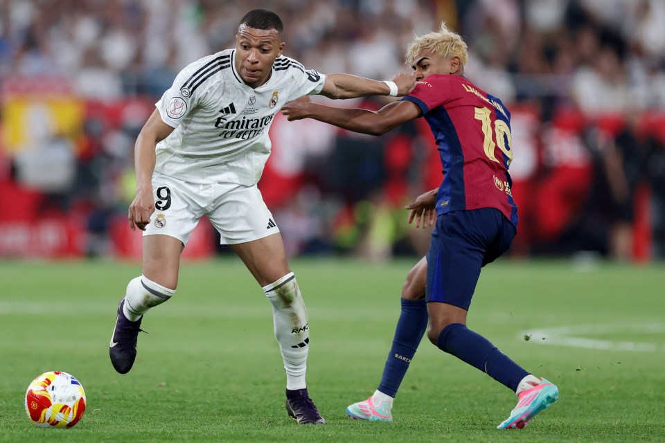 Kylian Mbappé of Real Madrid and Lamine Yamal of FC Barcelona during a soccer match.