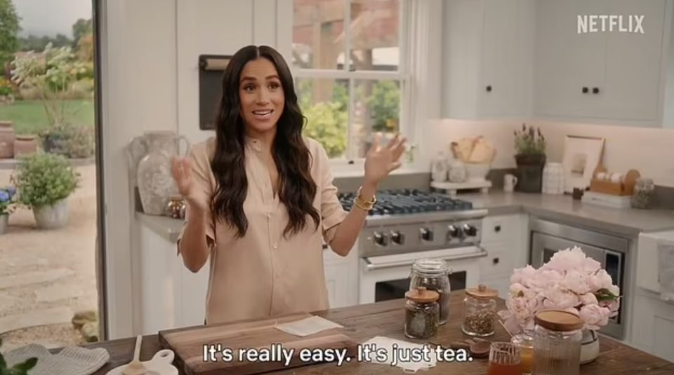 Meghan Markle making tea in her kitchen.