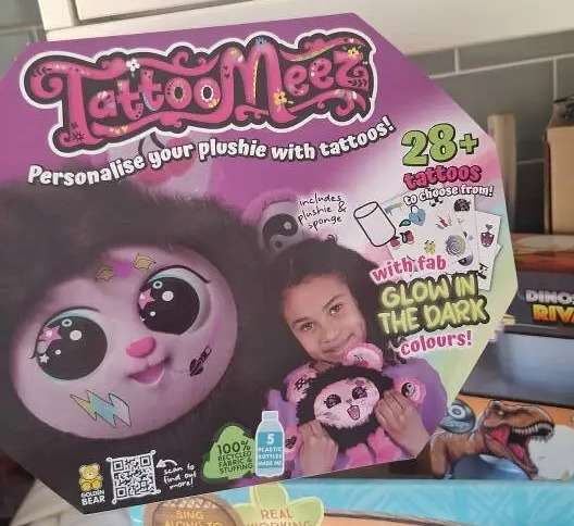 Packaging for Tattoo Mees plush toy with 28+ tattoos.