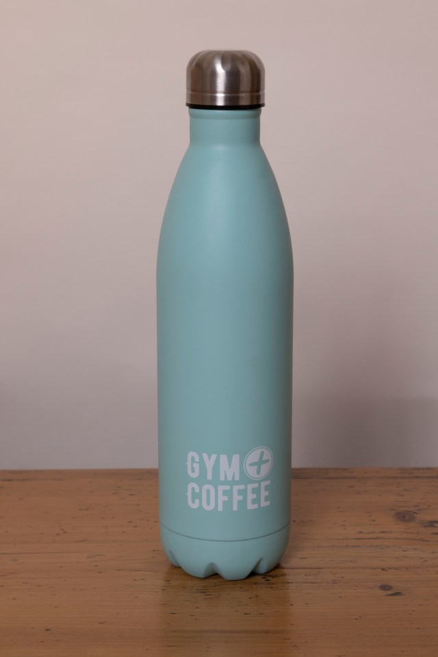 Light teal insulated water bottle with Gym + Coffee logo.