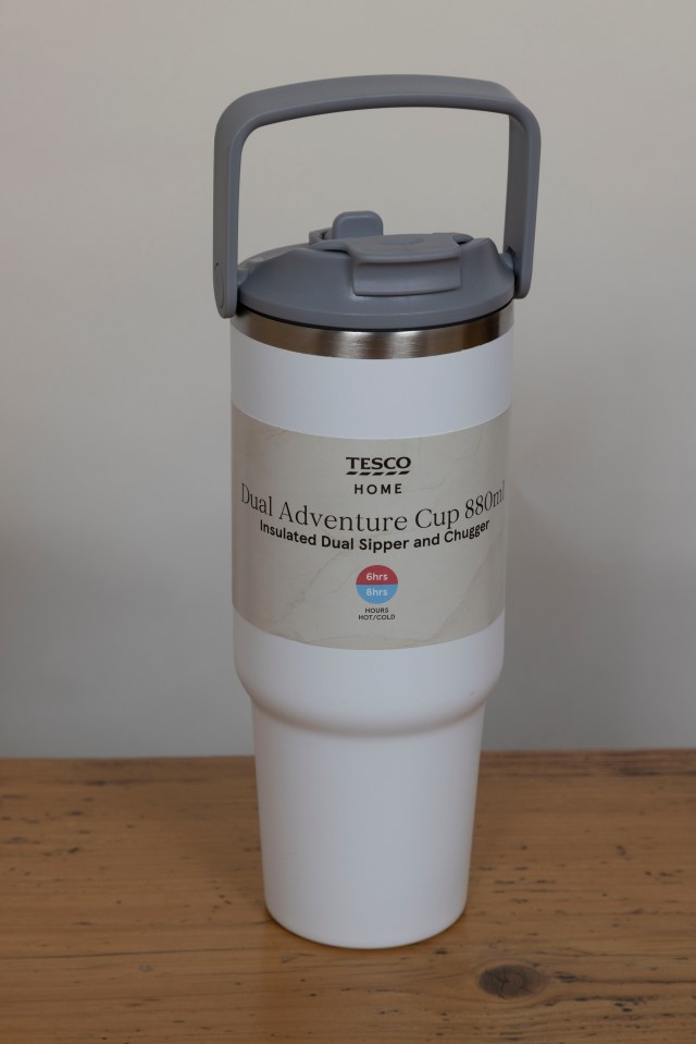 White insulated water bottle with handle.
