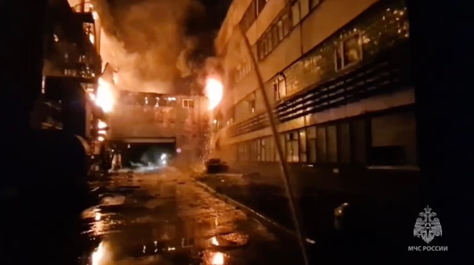 Large fire engulfing a paint plant.