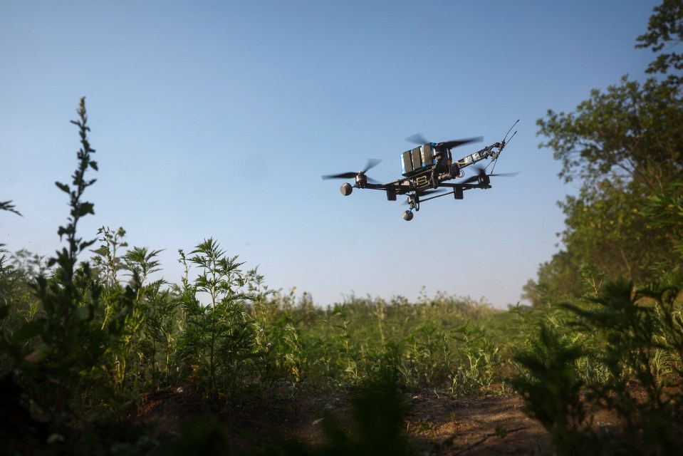 FPV drone in flight over vegetation.