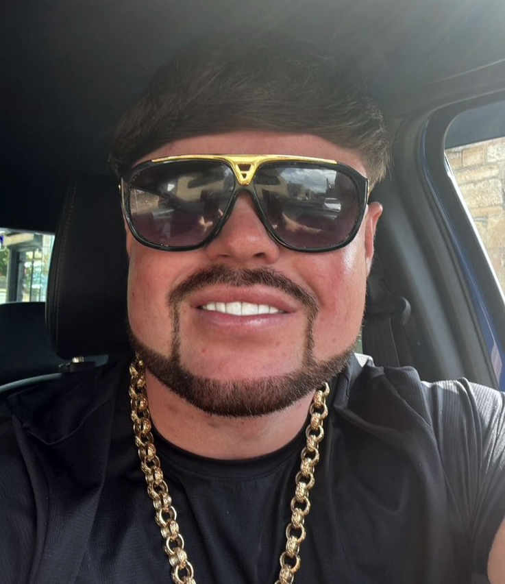 Close-up photo of Jack Kay, the "Ibiza Final Boss," wearing sunglasses and a gold chain.