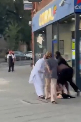 Road rage brawl on the sidewalk.