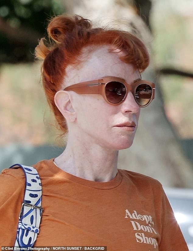 After working up a sweat, she left the class with red tresses pulled back into a high ponytail, and a blue and white tote bag slung over her arm