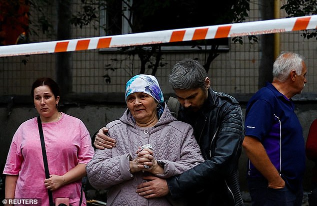 Residents react after a deadly strike on apartment buildings in Ukraine