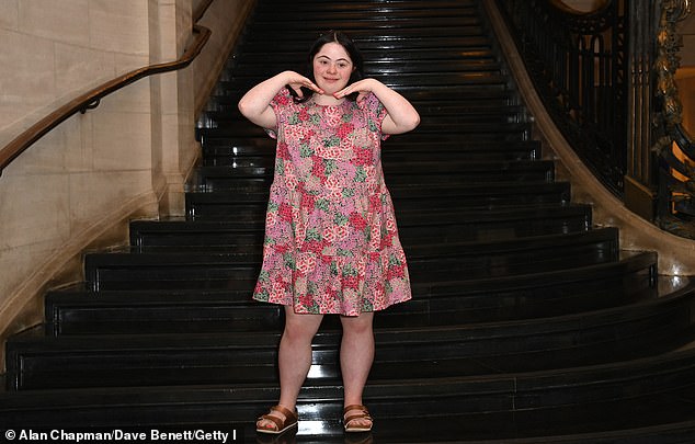 Ellie is a model, actress and influencer who became the first model with Down syndrome to grace the cover of British Vogue (pictured on the catwalk in  June 2025)