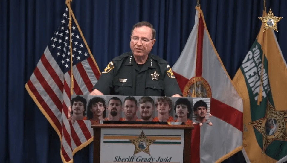 Sheriff Grady Judd displays mugshots of those arrested in a Florida lake brawl.