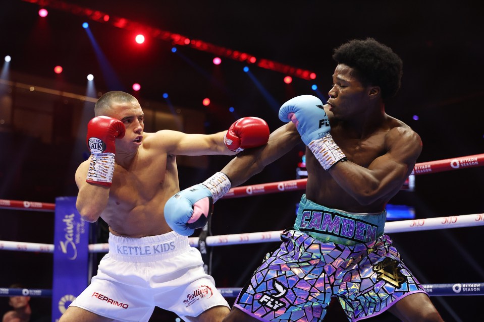 Boxers Nick Ball and Raymond Ford exchanging punches during a boxing match.