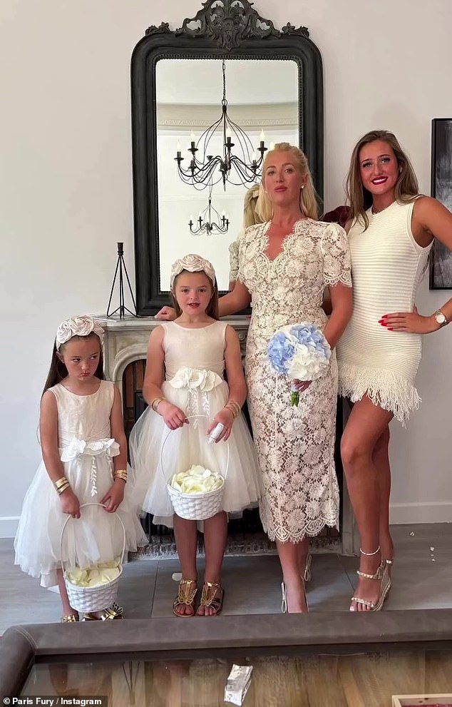Paris looked incredible in her lace midi dress and a bouquet of pale blue flowers