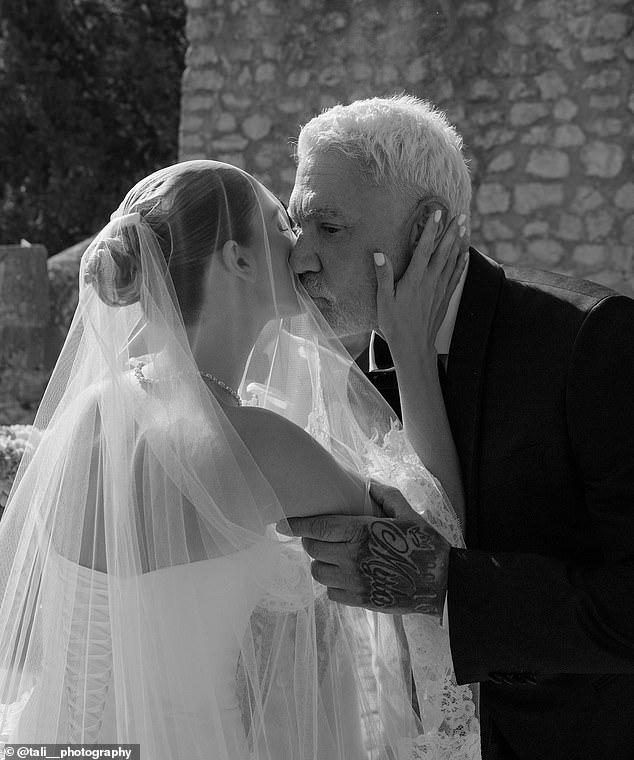 Wayne was every inch the doting dad as he spent time with her on her wedding day