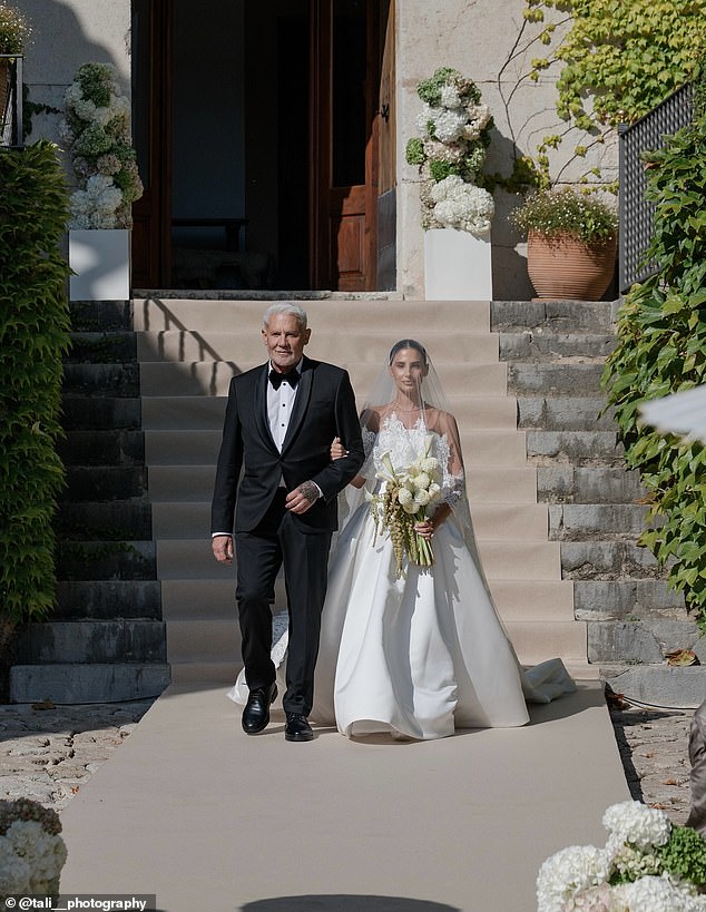 Wayne looked proud as he walked her down the aisle