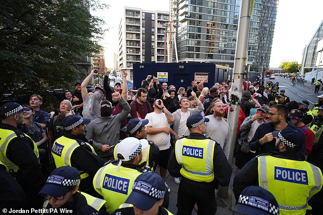 The migrant hotel in Canary Wharf has been at the heart of protests for almost two weeks and on Friday swarms of anti-migrant protesters descended upon the migrant accommodation (pictured)