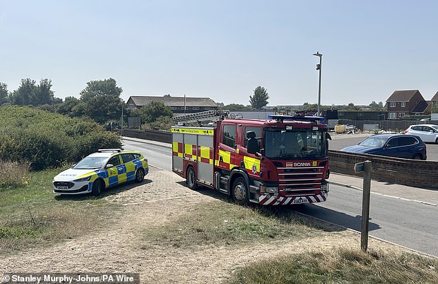 Emergency services pictured at the scene yesterday as they continued to searches for evidence