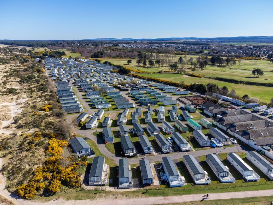 Aerial view of static caravans and holiday homes at a park.