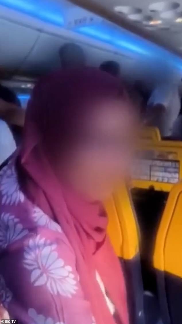 One mother was seen trying to console her child, telling them: 'It's okay, it's okay. We're going now'