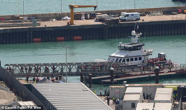 Migrants were later seen disembarking at Dover after being picked up mid-Channel by UK Border Force