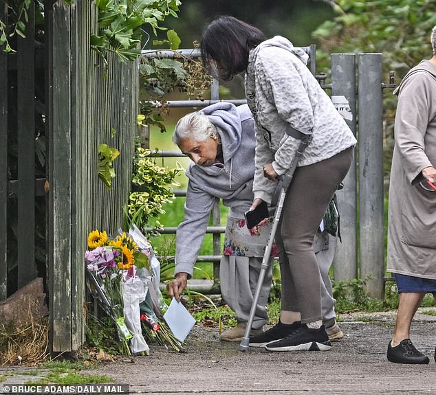 Mr Kohli's wife Satinder lays a floral tribute to her late husband by the park last September