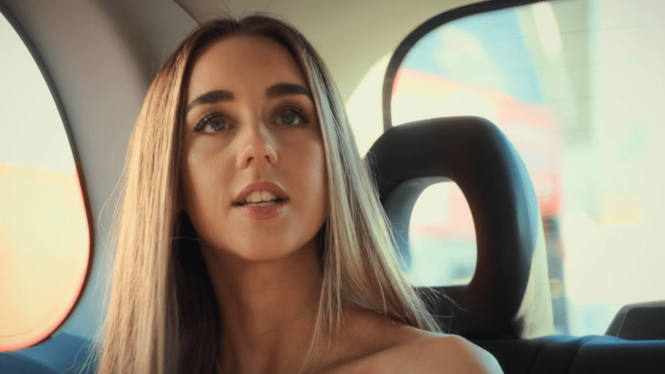Princess Andre in the back of a car.