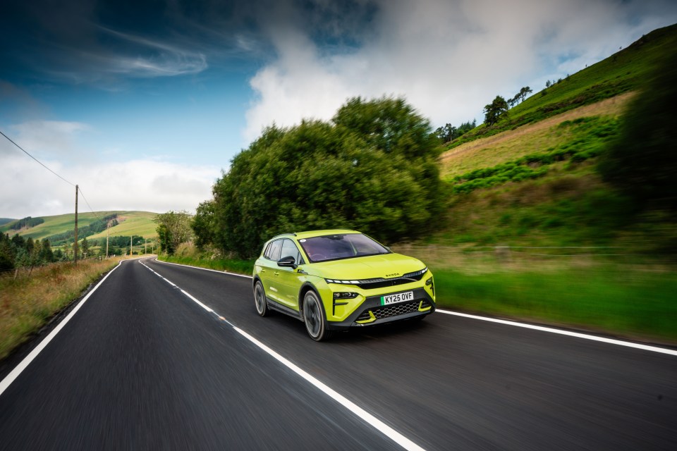 Lime green Skoda driving on a country road.