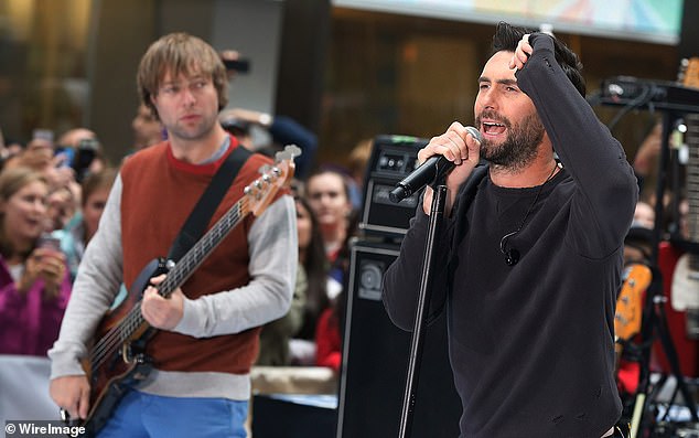 He stepped away from Maroon 5 in July of 2020 after he was arrested in connection with domestic violence; Pictured performing with Adam Levine in 2013
