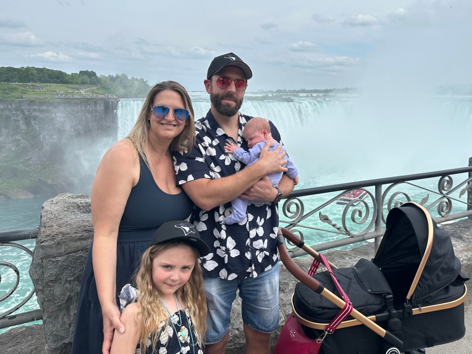 Family with a newborn baby at Niagara Falls.