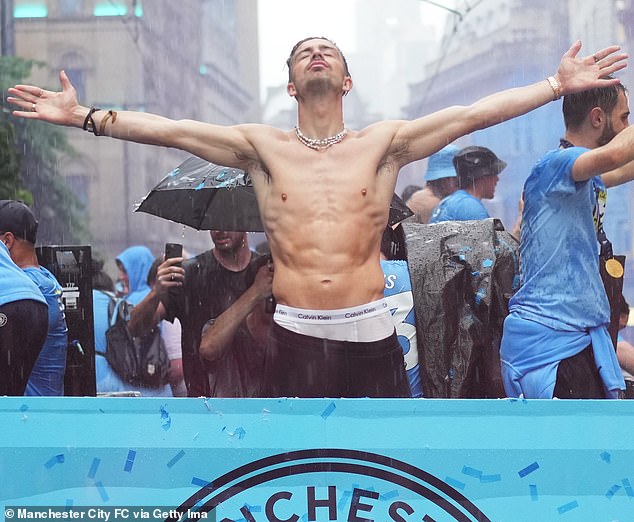 Front and centre: Grealish has been a Manchester City poster boy during his time at the club, helping to sell merchandise around the globe (pictured at the trophy parade in 2023)