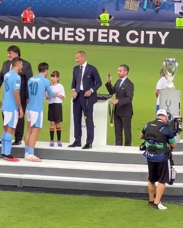 Kind: Grealish gave his undivided attention to a young fan, who is visually impaired, while accepting the UEFA Super Cup in 2023 - and has long been praised for his ability to
