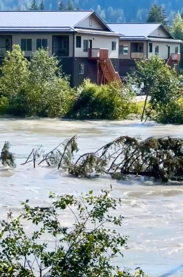City officials urged residents living within the 17-foot lake level inundation zone to evacuate the area immediately. Pictured: The engorged Mendenhall River flowing through Juneau, Alaska, on August 13, 2025