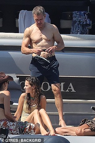 Matt flexed his bulging biceps while fiddling with a snorkel before his swim