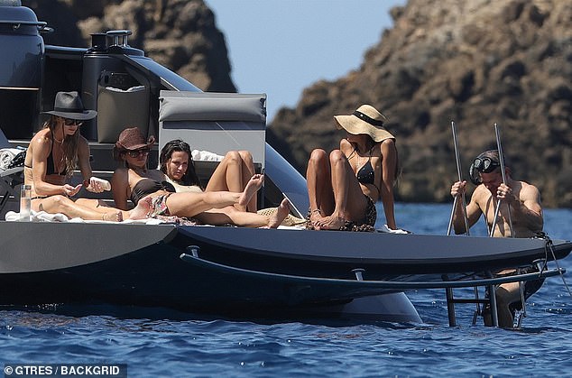 Luciana was surrounded by three swimsuit-clad gal pals as she sunned herself on the deck
