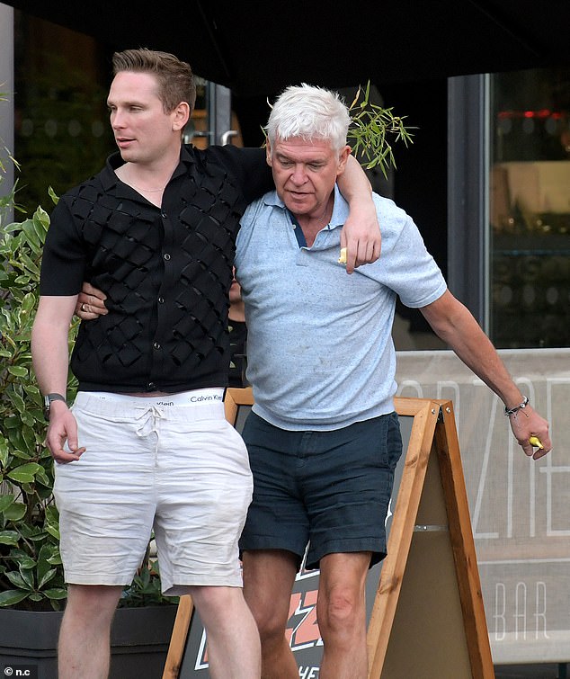 Holly's outing comes two days after pictures emerged of Phillip enjoying a boozy afternoon in London with a male companion