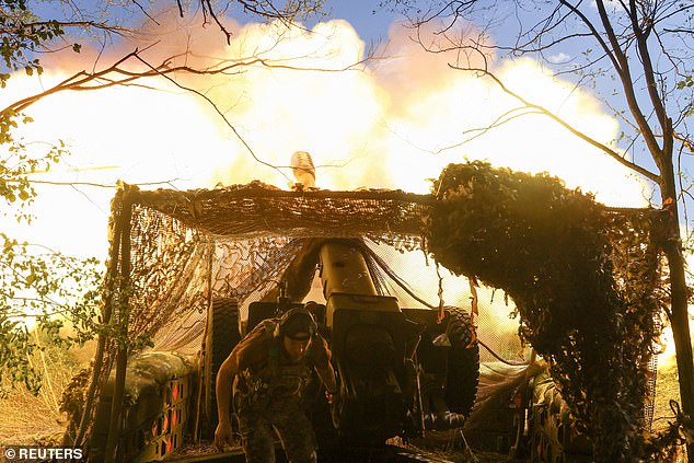 It will be the first time any major Western leader, aside from Putin's friend Viktor Orban, has met with the dictator since his illegal full-scale invasion of Ukraine in February 2022. Pictured: A serviceman of the Ukrainian Armed Forces fires a D-30 howitzer towards Russian troops, amid Russia's attack on Ukraine Ukraine August 5
