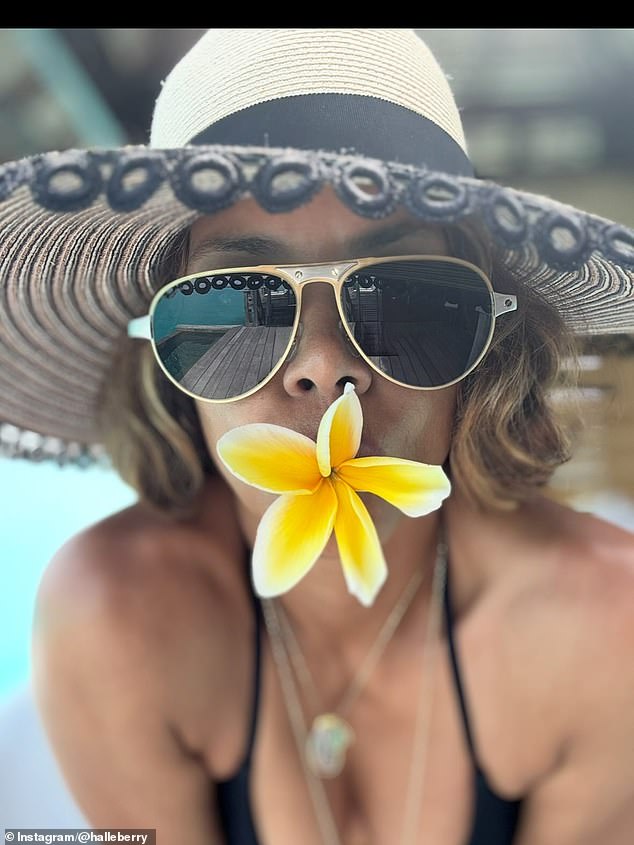 This arty image showed her with a yellow flower in her mouth