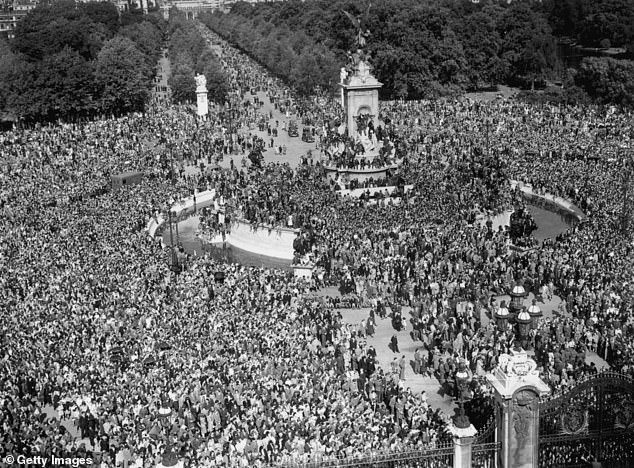 Jubilant crowds gather outside Buckingham Palace, hoping to see the King, following news of Japan's surrender, August 10, 1945