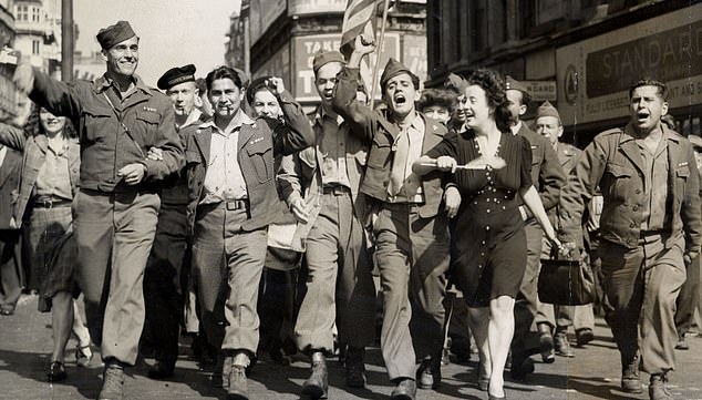 Americans celebrate with Londoners after news of Japan's impending surrender, August 10, 1945