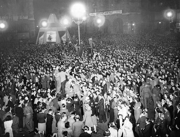 Crowds gathered in Piccadilly Circus celebrating the imminent surrender of Japan, August 10, 1945