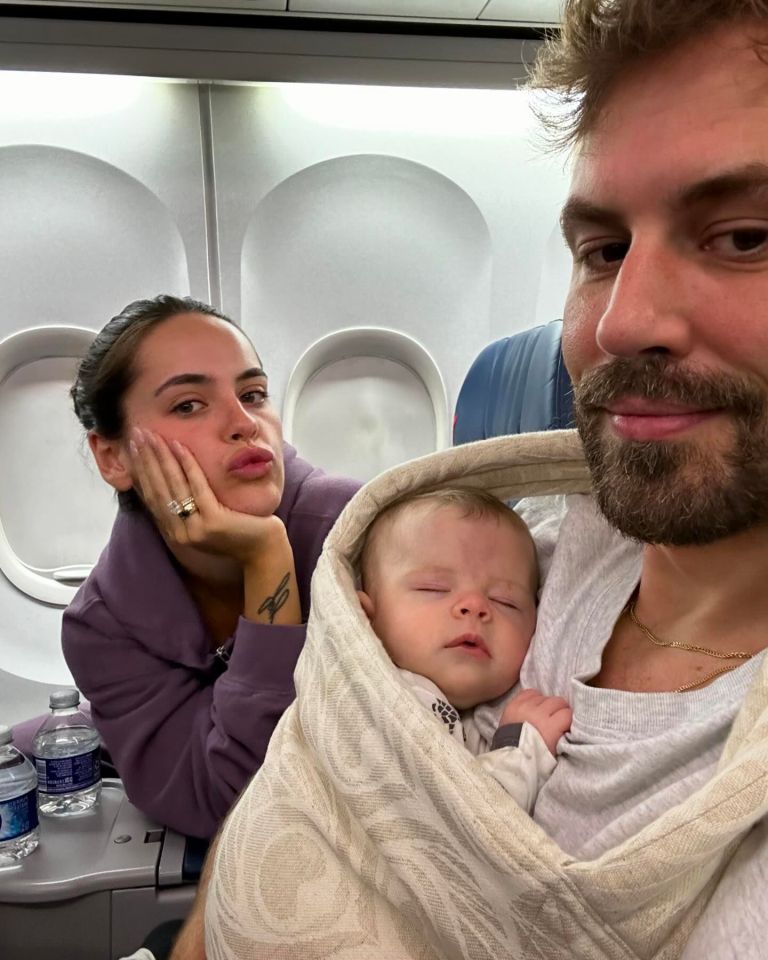 Nick Viall, Natalie Joy, and their baby on an airplane.