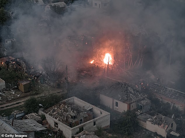 A blaze in a residential area following a powerful explosion as emergency services respond to the aftermath of the fire, on August 14, 2025 in Sloviansk, Ukraine