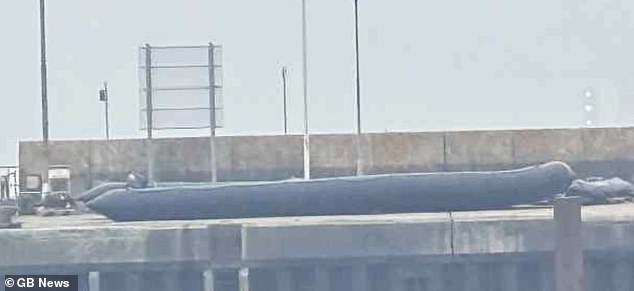 It comes just days after a record 107 small boat migrants reached Britain in just one dingy, confounding Labour's pledge to 'smash the gangs'. Images from the port of Dover showed human traffickers have begun to deploy a new, longer type of inflatable